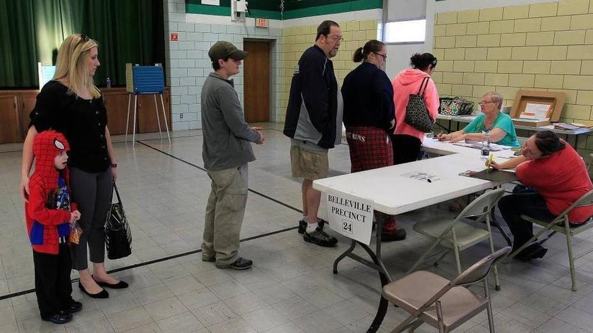 Voters kept election judges busy at Douglas School, where residents of Belleville Precincts 24 and 25 cast their votes. By 8:15 a.m. over 100 people had voted at the school on the east side of town.