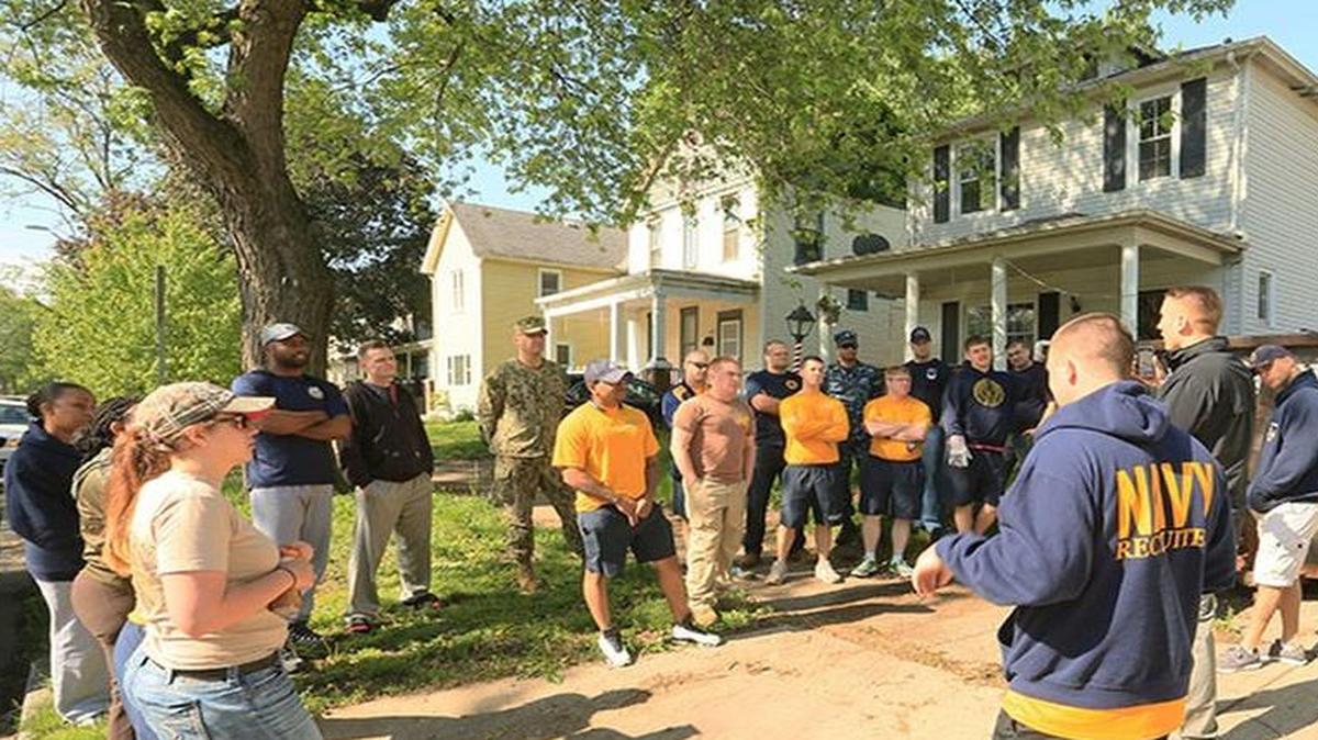 Sailors from Navy Recruiting District St. Louis receive a safety brief prior to conducting a Habitat for Humanity project. Sailors helped reconstruct a home during the volunteer event as part of CPO 365 training. CPO 365 is a year-long program designed to ensure the CPO Mess and first class petty officers are continually and steadily developing to succeed in future leadership positions and affords the opportunity for education and training.