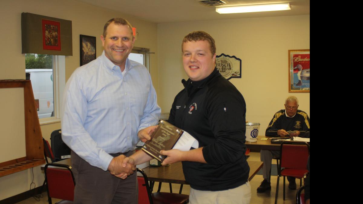 
Highland Police Chief Terry Bell, left, presents the Telecommunicator of the Year, which is sponsored by the Highland Moose Club, to Brad Sutton. 
