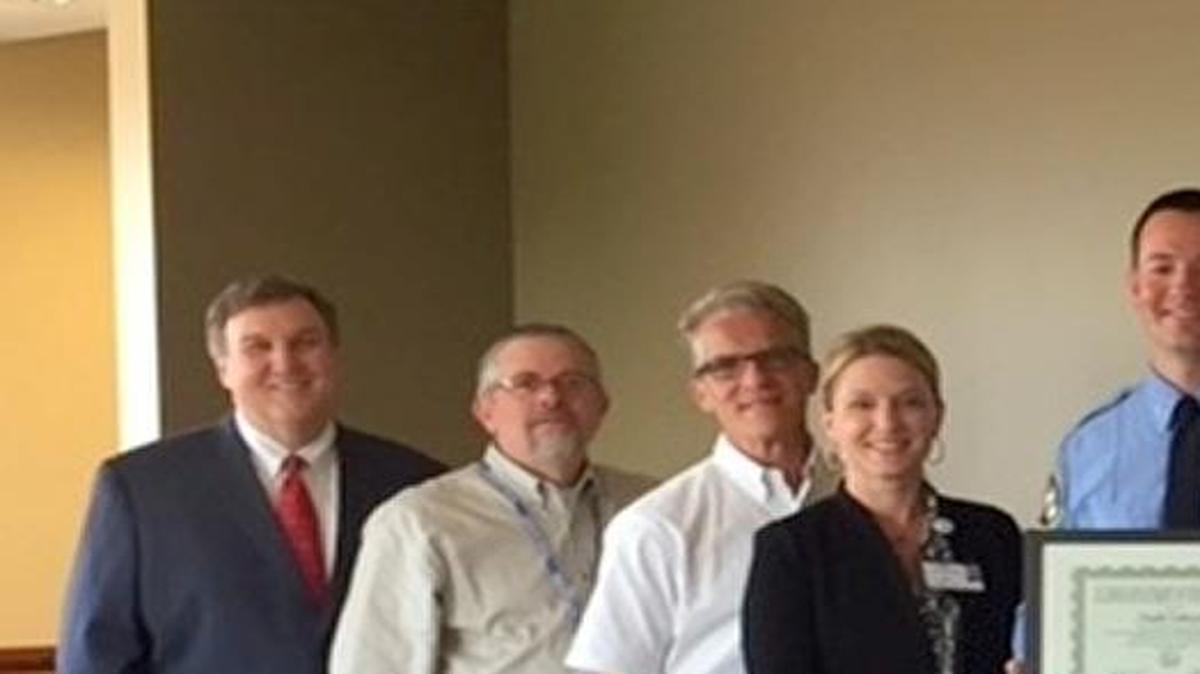 From left are Keith Page, Anderson Hospital president; Brad Perry, Anderson Hospital EMS coordinator; Eric Brandmeyer, Anderson Hospital emergency preparedness director; Lisa Klaustermeier, Anderson Hospital chief nursing officer; Todd Zobrist; Brian Wilson, Highland Fire-EMS; and Tim Rusteberg, Highland-Fire EMS captain.