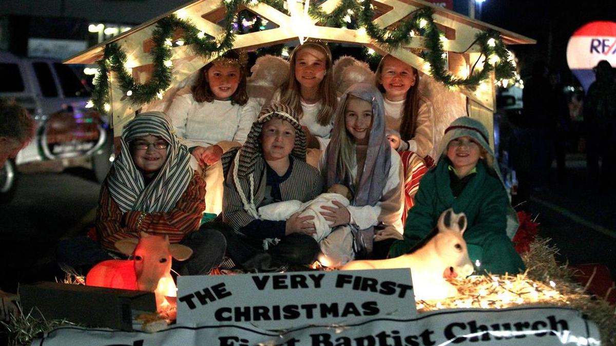 The float for First Baptist Church in the Highland Chamber of Commerce Lighted Christmas Parade featured a nativity scene. First row from left are Colin Shoemaker, and William, Sophia and Matthew Rogier. Angels in back are Eliza Rogier, Ella Kirbach, and Phoebe Rogier.