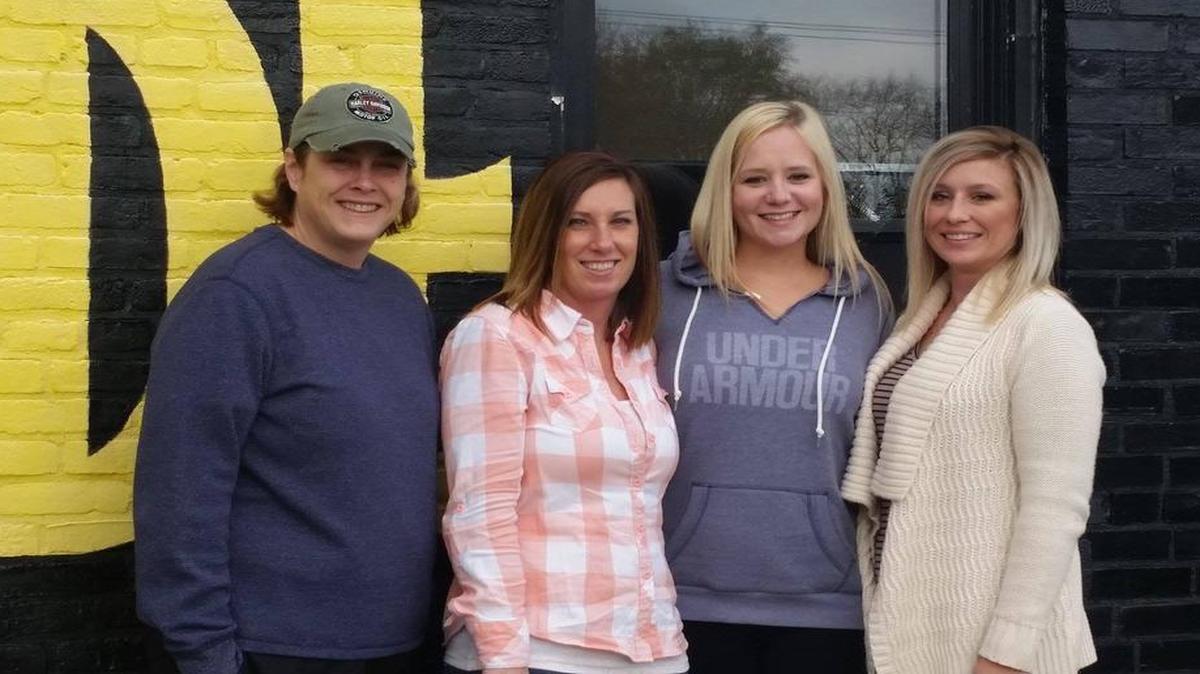 From left are Railshake Kitchen Manager Bridget Voegele, Assistant Manager Tricia Stock, Owner Teffy Beard, and General Manager Casey Driemeyer as they stand outside Railshake, celebrating Teffy’s purchase of the building, officially making the business and area her own.