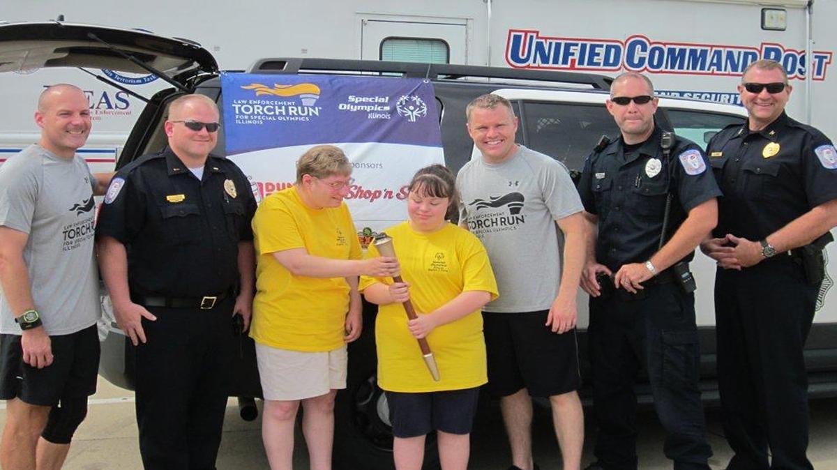 
From left are Highland police officer Aric Steinbeck, HPD Lt. Chris Conrad, Special Olympians Holly Wrobbel and Kim Schmidt, HPD officers Chris Flake, David Brines and Chief Terry Bell.
