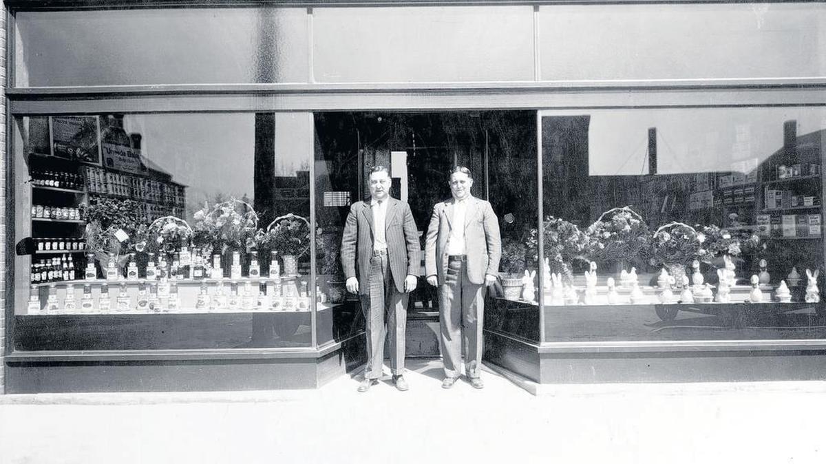 Edward “Rox” (left) and Albert “Pat” Steiner stand in front of the Steiner Brothers Grocery Store at 809 Broadway in Highland. The photo is believed to have been taken in the spring of 1930 for their open house, as there is no sign yet above the buisness, just the wires. Also, the baskets and bunnies in the window are believed to have been for Easter. The photo is from their sister, Mrs. Charles Hoffmann of Marine.