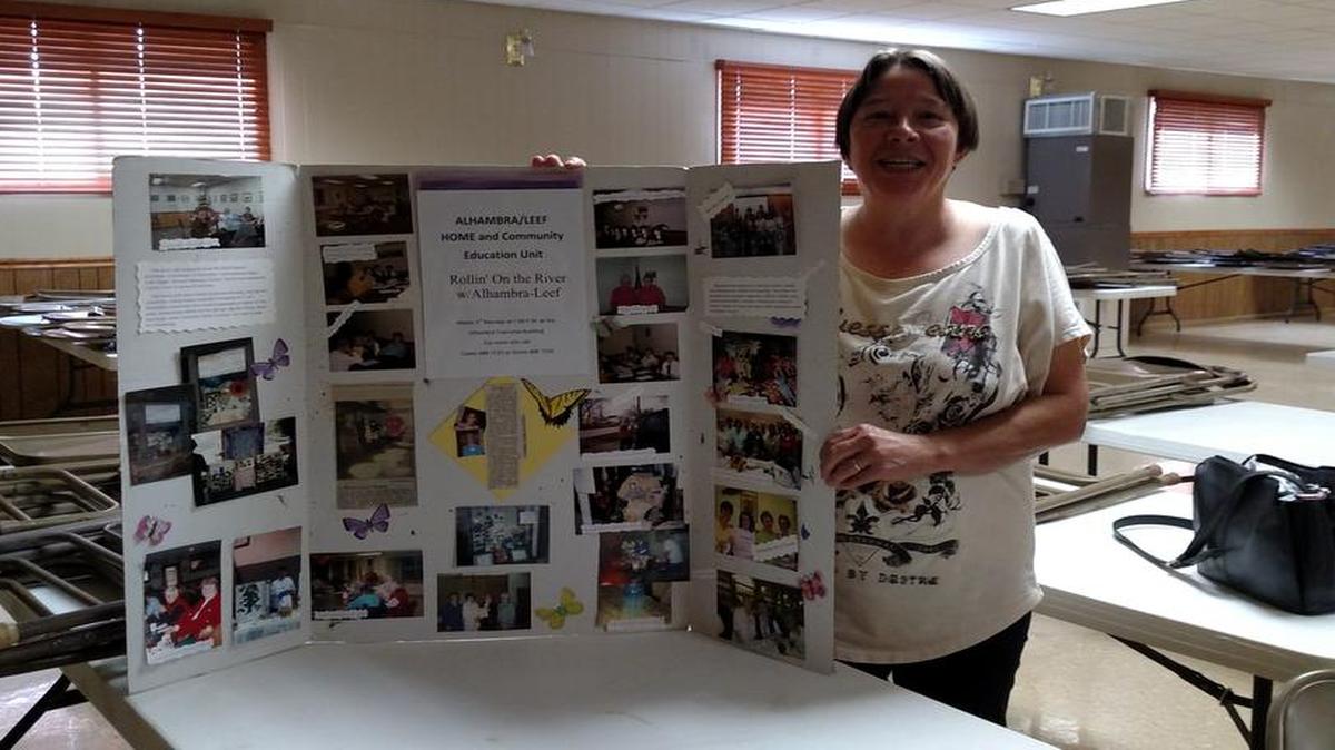Alhambra-Leef Home Extension has been busy: Candy Huckleberry of the Alhambra-Leef Home Extension shows off the posters of some of the projects that have been done by the Homemakers. The past blood drives have been a success, and even with the restrictions on blood donors, the HCE unit got 24 units of blood for the Red Cross. The next Red Cross Blood Drive will be held at the Alhambra Township Park in the Firemen & Legion Hall in December.