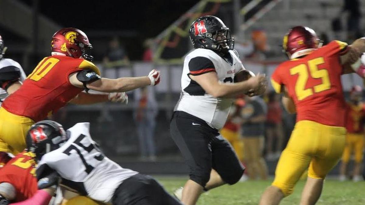 Highland senior Colten Knebel is usually the starting left guard on the offensive line but here he is shown getting to tote the ball as he follows his blocking, including by his twin brother, Dylan Knebel, on the right side of the photo. Colten Knebel rumbled for a 25-yard gain on the play and later on, Dylan Knebel had a 25-yard run of his own.