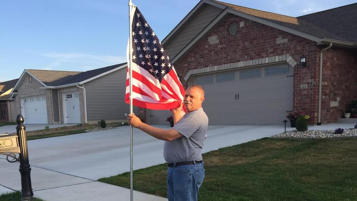 Highland Optimist Club President Dave Callahan sets up a flag in a subscriber’s yard as part of a new fundraising effort by the club. The program is called “Avenue of Flags.” For $40, a homeowner can buy a subscription where an Optimist member will set up and take down an American flag in their yard for the nation’s five national holidays: Memorial Day, Flag Day, Fourth of July, Labor Day and Veteran’s Day.