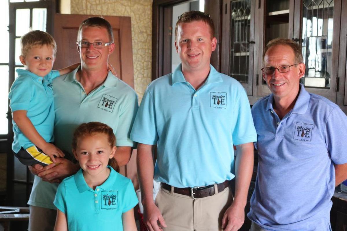 From left to right, Tommy Jackson, Joe Jackson, Emma Jackson, Andy Jackson and Bob Jackson are restoring the the Mewes house, located at 206 St. Rt. 143 in Pierron, to create a simple food cafe called the Wooden Tie Cafe. The cafe is scheduled to have its grand opening on Labor Day weekend. Each member of the family preforms a specific job to help get the business up and running. Not pictured are Mary Jackson and Sharon Jackson.