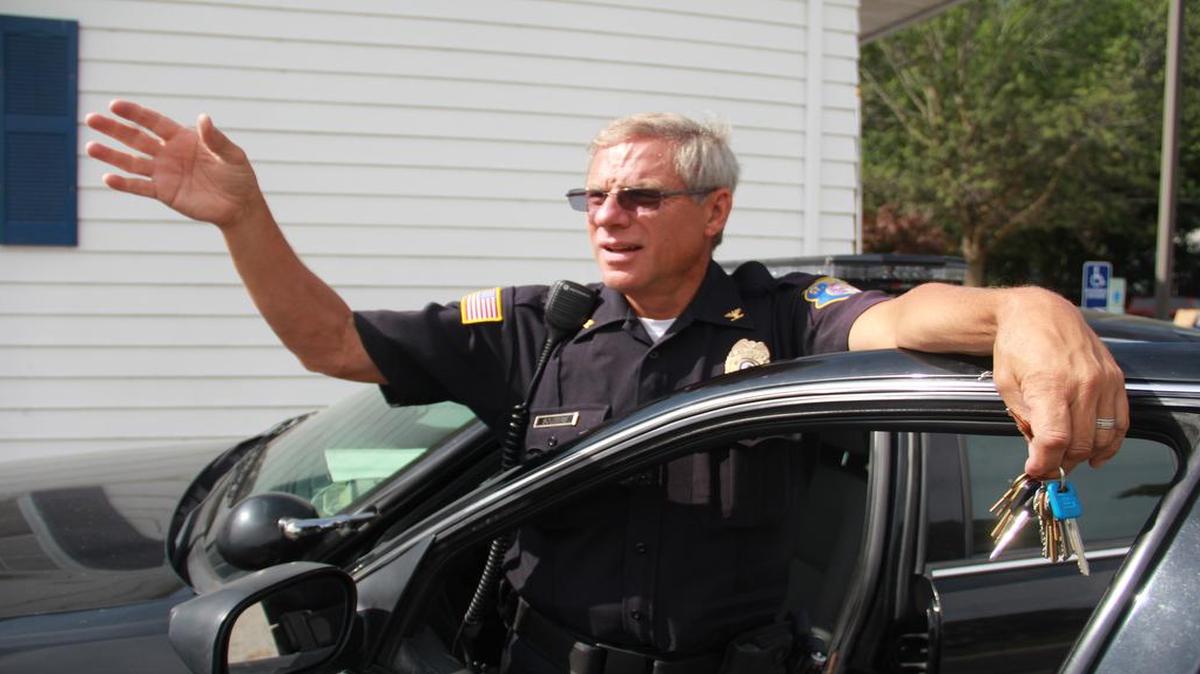 
Jeff Souders waves to a passerby.
