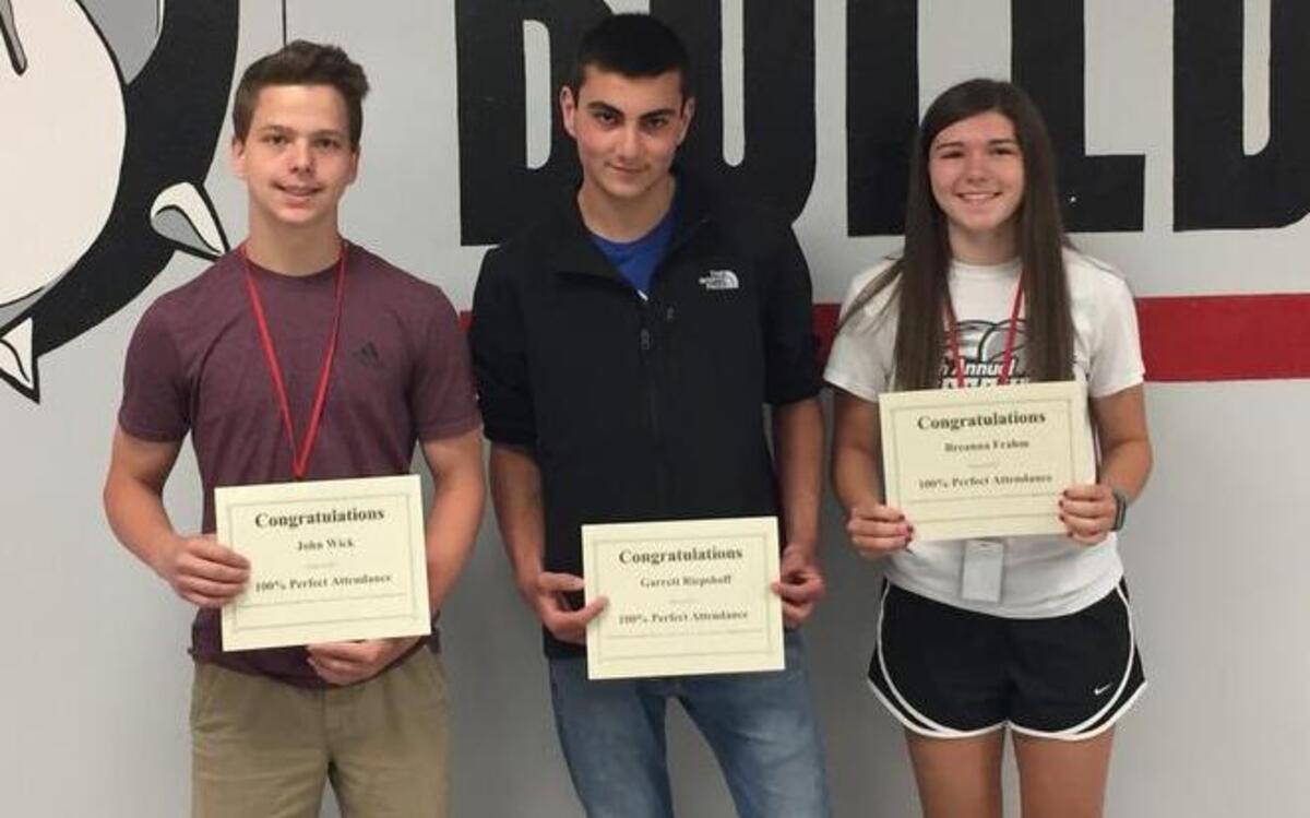 SENIORS The following three seniors graduated with perfect attendance for all four years of high school. Each missed less than three hours of school during their attendance at HHS. From left are John Wick, Garrett Riepshoff and Breanna Frahm.
