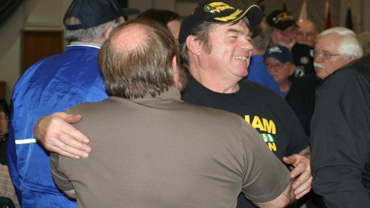 Vietnam veterans Kevin Isenhart, back turned, and Jack Stewart share a ‘welcome home’ hug during a ceremony at Highland Hope UMC on March 29 to honor local Vietnam vets. The keynote speaker, former state Rep. Ron Stephens, himself a Vietnam vet, had the 50-plus veterans in attendance all share a handshake and a hug to welcome one another home.
