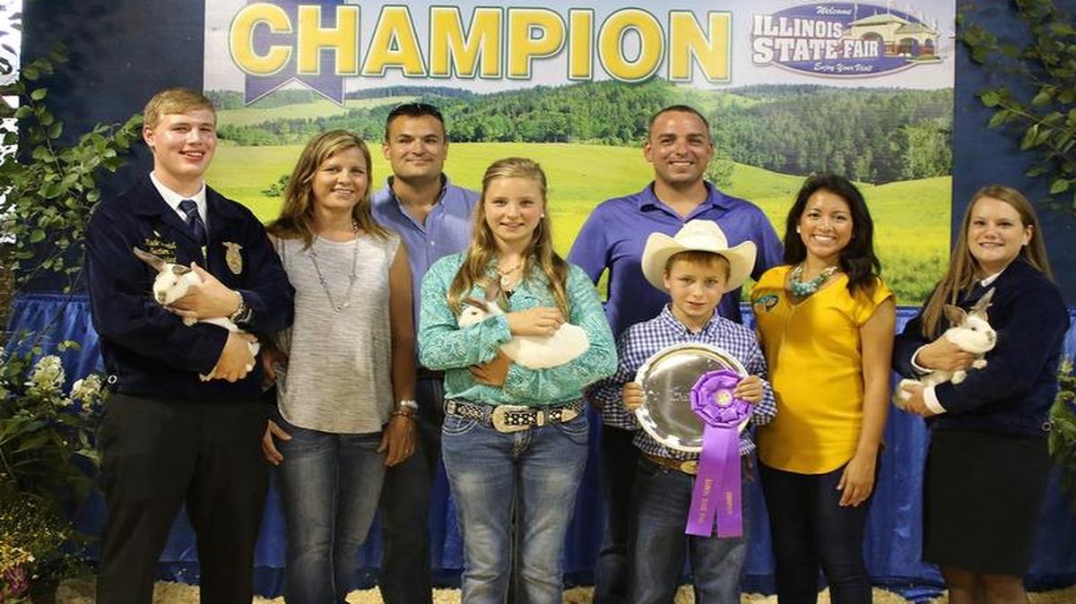 
Morgan Wilderman of Greenville, center, had the Grand Champion Rabbit Meat Pen Trio at the state fair and sold her rabbits at the Governor’s Sale of Champions.
