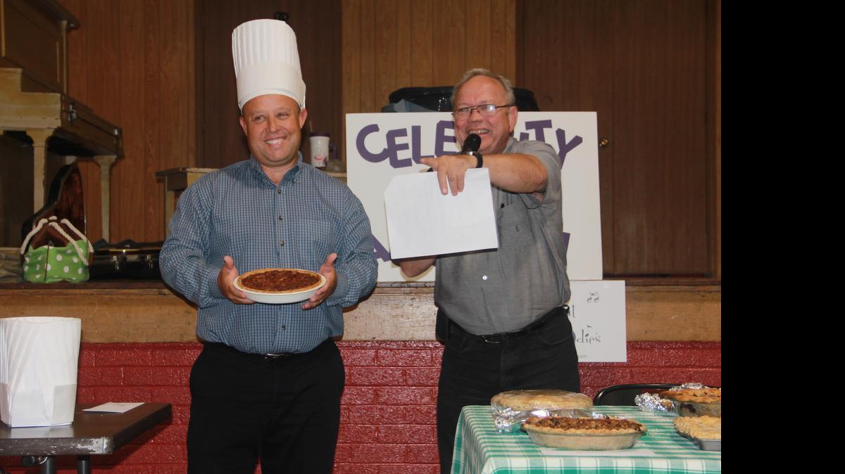 
Highland School Superintendent Mike Sutton laughs while Virgil Straeter auctions off his pecan pie at the Highland Relay For Life Celebrity Pie Auction Friday at the Weinheimer Community Building. The Oldies but Goodies Relay for Life team, which is sponsored by the Highland News Leader, hosted the event, which raised $3,525.
