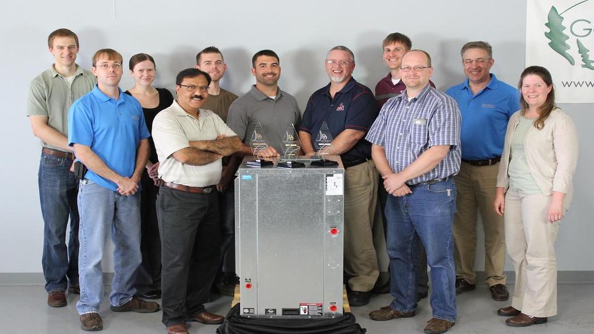 
Enertech Global employees pose with the awards the company recently won in the 2015 Dealer Design Awards presented by The Air Conditioning Heating & Refrigeration News magazine.
