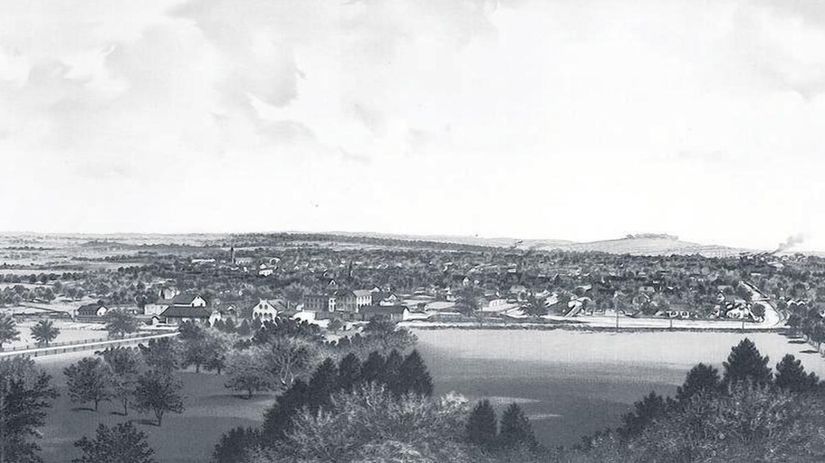 
This lithograph from 1894 was published by John S. Hoerner and shows Highland from the Giesler Hill, looking south at Sixth Street, turning into Walnut Street, and the left foreground is the new railroad depot and Giesler’s Railroad Hotel and Inn, now the Rail Shake Brewery & Pub.
