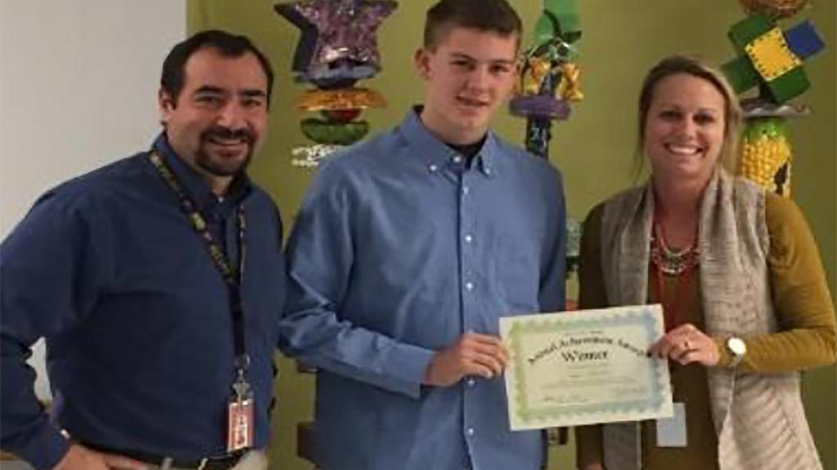 From left are Highland High School teacher Chris Durbin, Connor Mortland and Ashley Crays of Club Z In-Home Tutoring of Edwardsville.