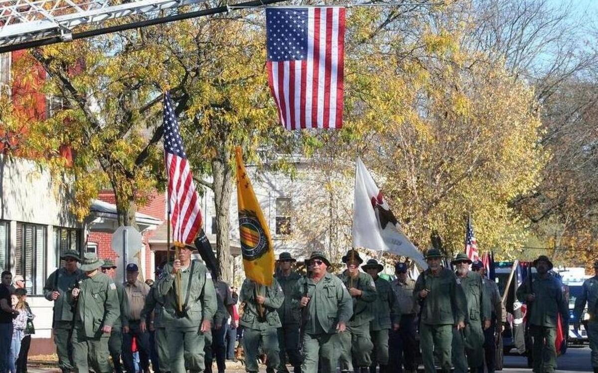 Members of Vietnam Veterans Chapter 269 out of Clinton County march in the Veterans Day parade in Highland last year.