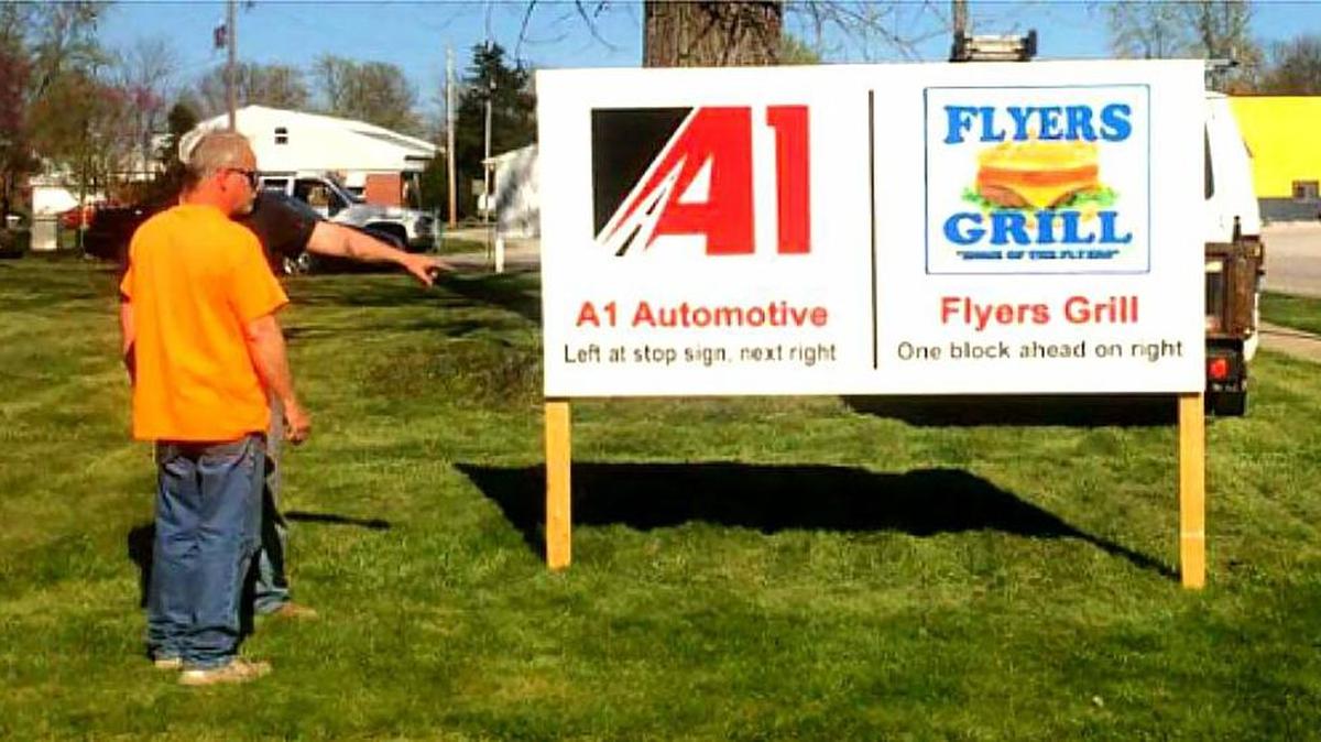 Sign erected at the S-Curve in New Douglas on W. Deck Street. Donated by The Graphic Department (George Grindstaff).