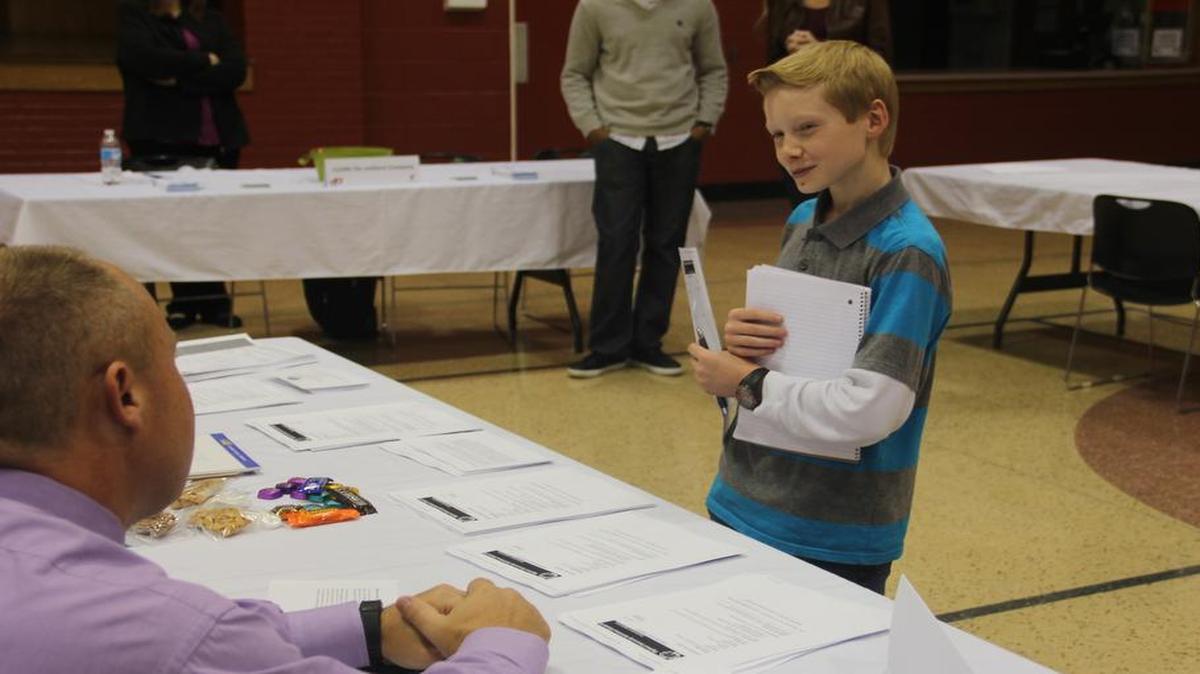 Austin Reinhardt visits with Highland Superintendent Mike Sutton at Friday’s first Highland Works bi-annual career fair.