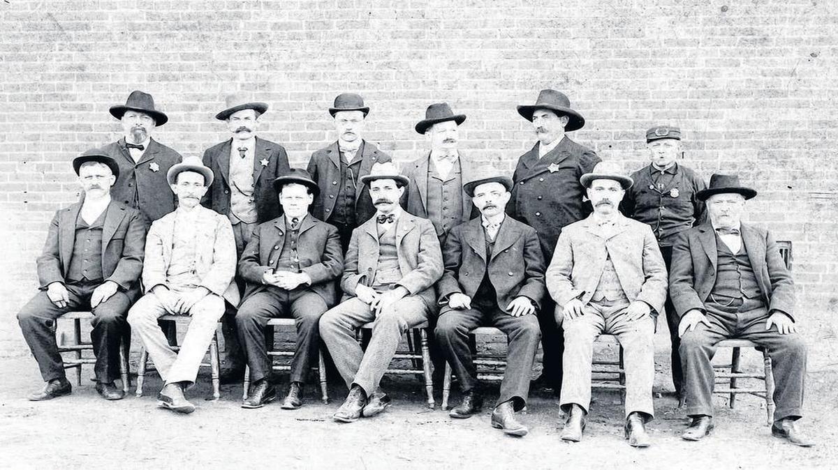 Highland City Administration, 1901-1902 Front row from left are aldermen Hy. Lory, Mat. Hoffmann and Eug. Schott, Mayor J.G. Bardill, aldermen L. Spengel, S. Kustermann, and F. Buettner, superintendent of streets. In the back row are police officers Chas. Beichel, F. Gehrer, Clerk F. Wildi, Police Chief Em. Winter and Fire Chief C. Rappenecker. Thanks to the Buettner, Ritt and Harris families.