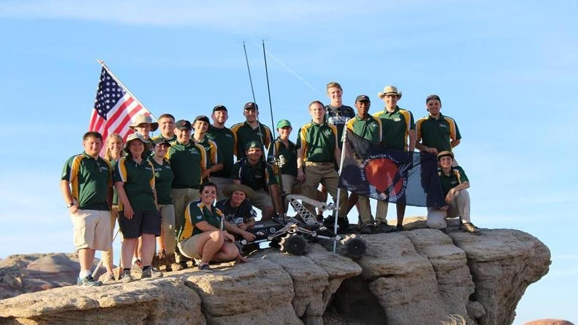 The Missouri University of Science and Technology Mars Rover Design Team at the international 2017 University Rover Challenge. The team is standing on the site of the Mars Desert Research Station in Hanksville, Utah, with their rover Gryphon. The team claimed first place out of 36 teams.