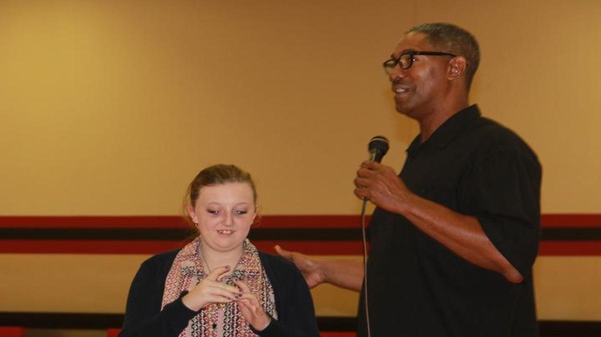 Faith Prather tries on Adrian Branch’s 1987 NBA World Championship ring.