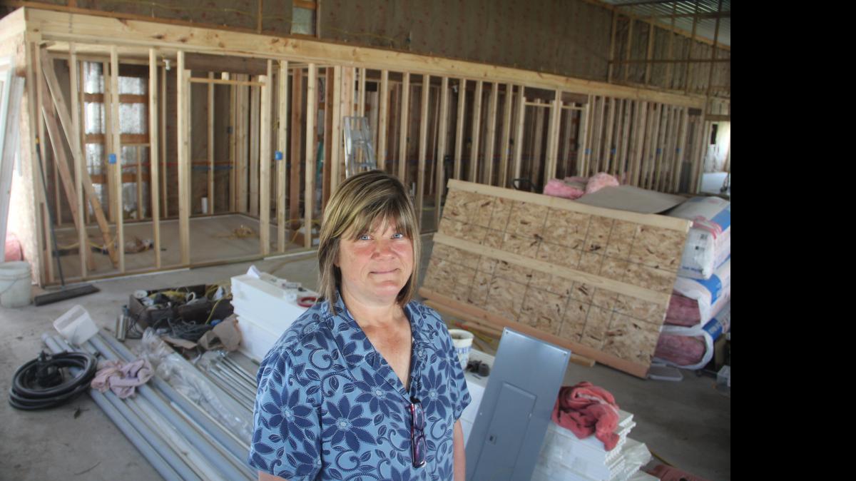 
Partners for Pets founder Lisa McCormick poses for a picture in thier new dog shelter now under construction.
