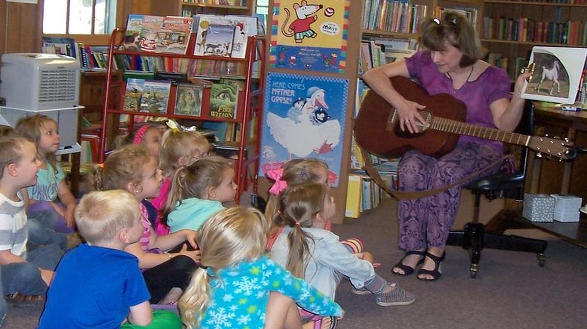Jennifer Hobbs Zahn reads to children from Windmill Pre-School during Children’s Book Week in early May at the Charles Gravius Memorial Library in Marine.