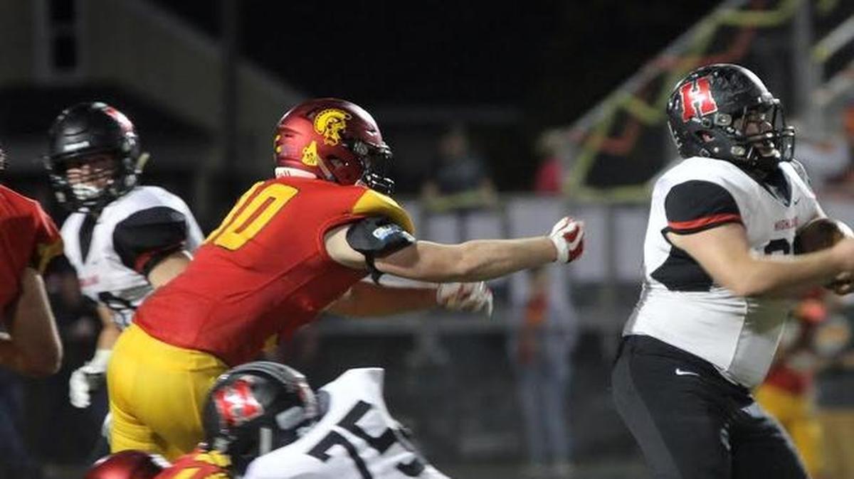 Highland senior Colten Knebel is usually the starting left guard on the offensive line but here he is shown getting to tote the ball as he follows his blocking, including by his twin brother, Dylan Knebel, on the right side of the photo. Colten Knebel rumbled for a 25-yard gain on the play and later on, Dylan Knebel had a 25-yard run of his own.