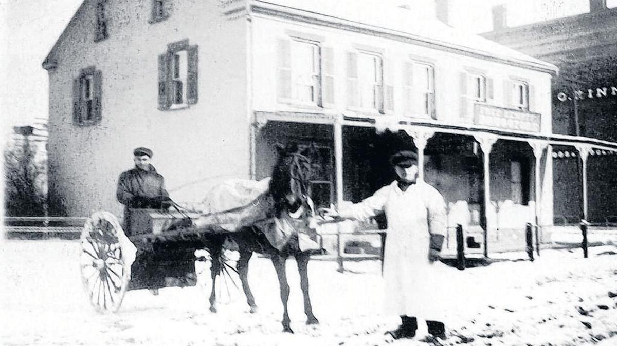 The Fredrick Kempff Pharmacy with the C. Kinne & Co. building in the background.