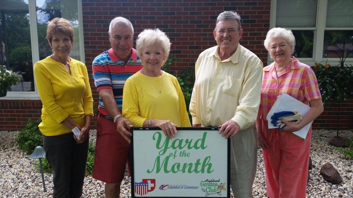 Dennis and Diane Giger of 2321 Poplar St. are Highland’s Yard of the Month for June. From left are Highland Garden Club member Nancy Hediger, Dennis Giger, Diane Giger, Highland Mayor Joe Michaelis, and Highland Garden Club member Judy West.