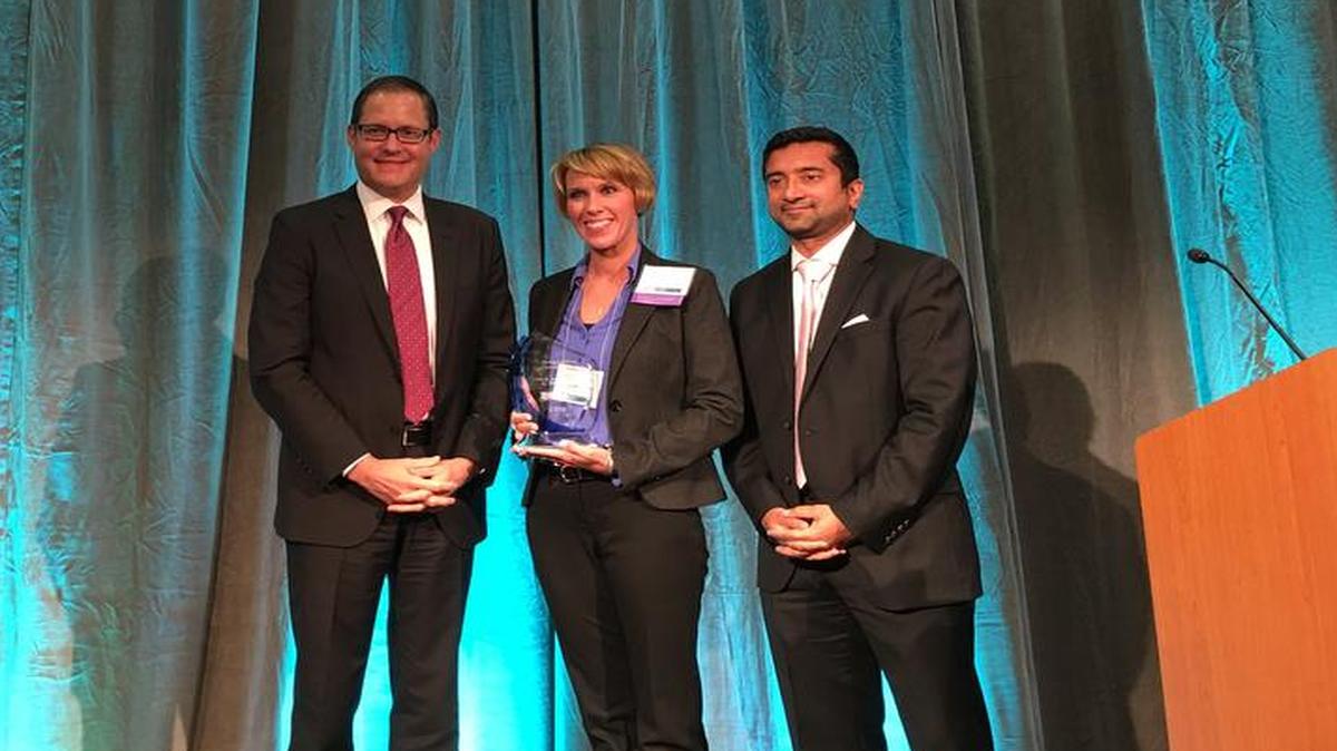 St. Joseph’s Hospital-Highland award: Elizabeth Govero, interim president and CEO of St. Joseph’s Hospital-Highland, accepts the award for Quality Excellence Achievement in the Rural/Critical Access Hospital category from the Illinois Health and Hospital Association (IHA) on Sept. 16. Govero was joined on stage by A.J. Wilhelmi, president and CEO of IHA, and Jay Bhatt, chief health officer for IHA.