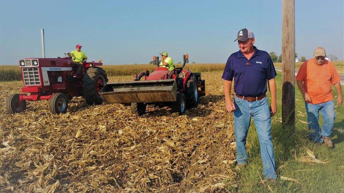Brent Hunsche, Travis Eilers, Cliff Schuette and Ted Krauskopf plant a variety of cover crops into the Field Day demo plot at the Hunsche Farm in Highland.