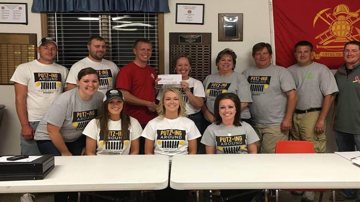 St. Rose Development Club Donation: Front row and seated, from left, are Brooke Mollet, Kayla Barth, Megan Barth and Amanda Detmer; back row, Brad Budde, Alan Winkeler, Austin Benhoff. Joyce Barth, Donna Tebbe, Tom Harper, Brian Robke and Justin Detmer.