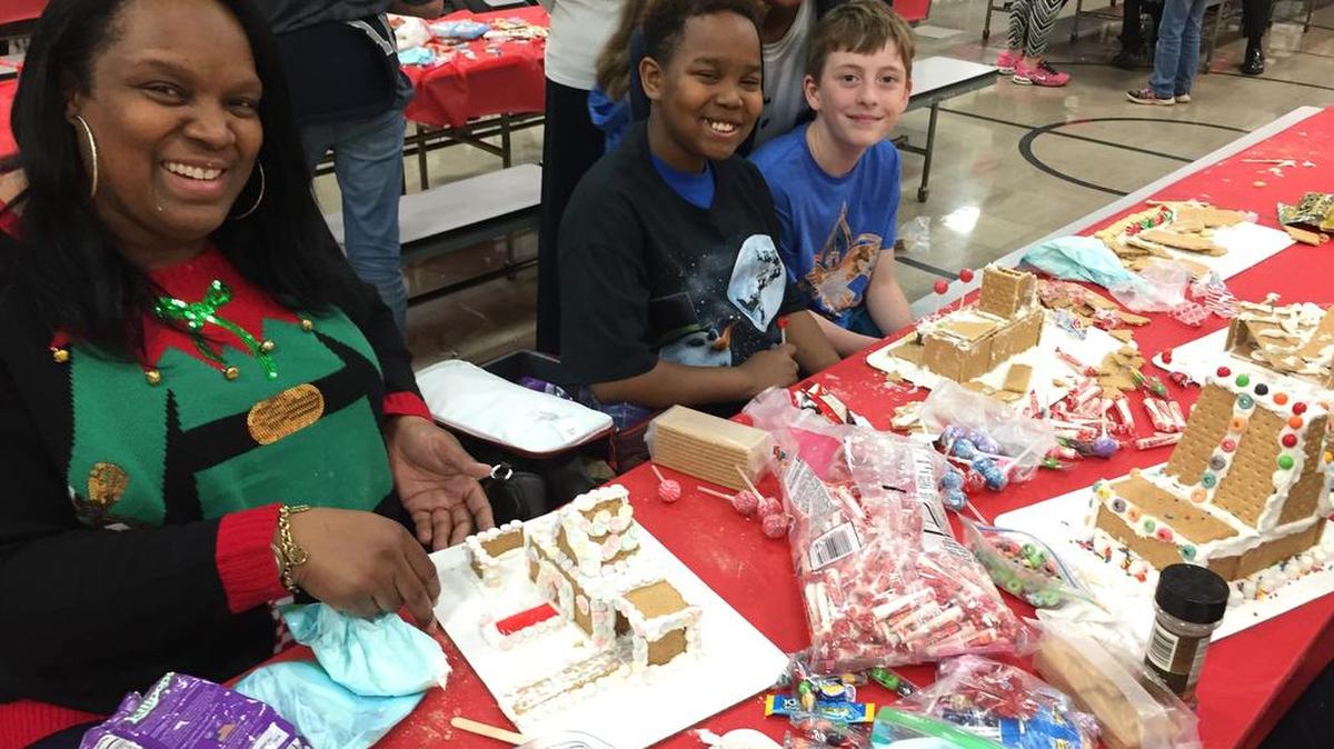 Aletha Owoseni and her son, Babatunde Owoseni and, friend James Delucio attended O’Fallon School District 90 LaVerna Evans Elementary School’s Gingerbread Night for students and their families to construct holiday gingerbread houses on Monday, Dec. 18.