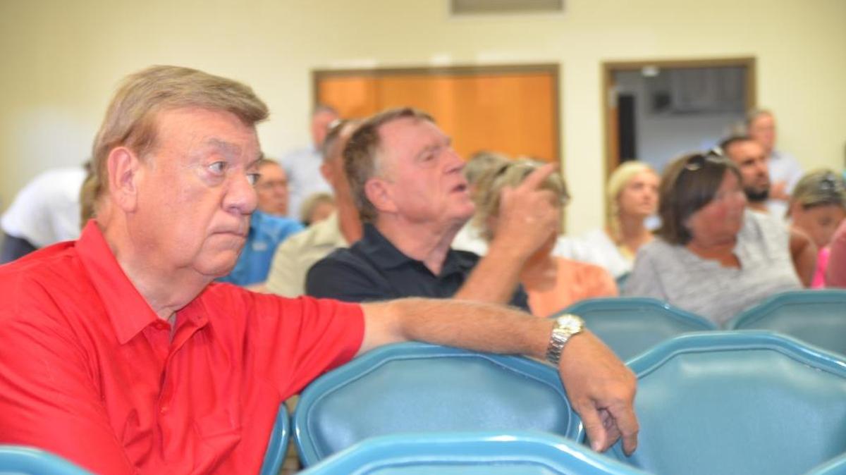 Joeseph Cipfl, of 1749 St. Andrews Drive sits and listens to a presentation given by Lisa Johnson, attorney from SmithAmundsen, representing the property owner of the 169.78 acres, JMB123 Properties LLC, owned by Dr. Kim Littlefield. Cipfl addressed the board about water drainage concerns that will impact his property.