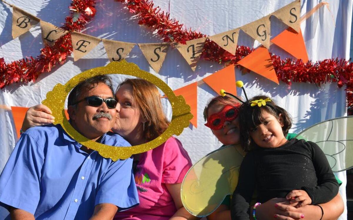 Halloween is around the corner, and Shiloh United Methodist Church hosted its annual Trunk or Treat event Sunday, Oct. 23 for local members and residents. During family-friendly event, grandparents sneak a golden framed kiss at the Fall Fest photograph booth.