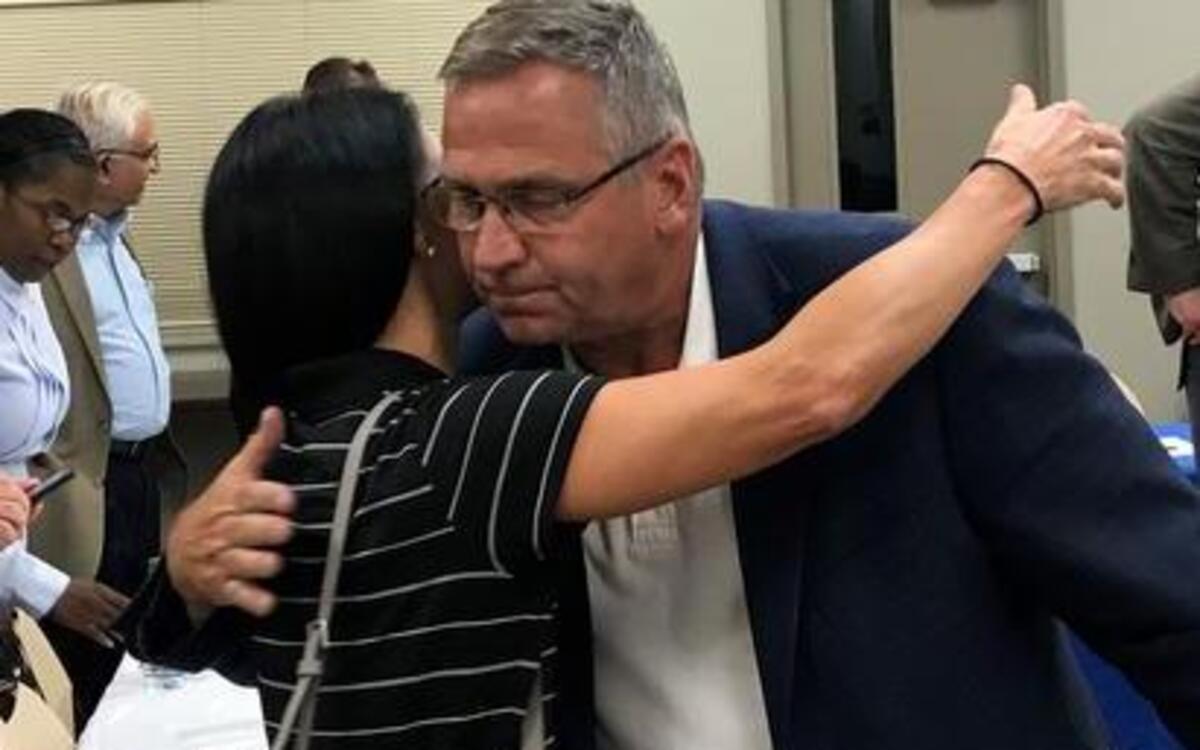 Congressman Mike Bost hugs Dr. Kari Karidis an opioid task force meeting at the Katy Cavins Community Center in O’Fallon. Karidis started an advocacy organization after her son’s overdose death in 2013.