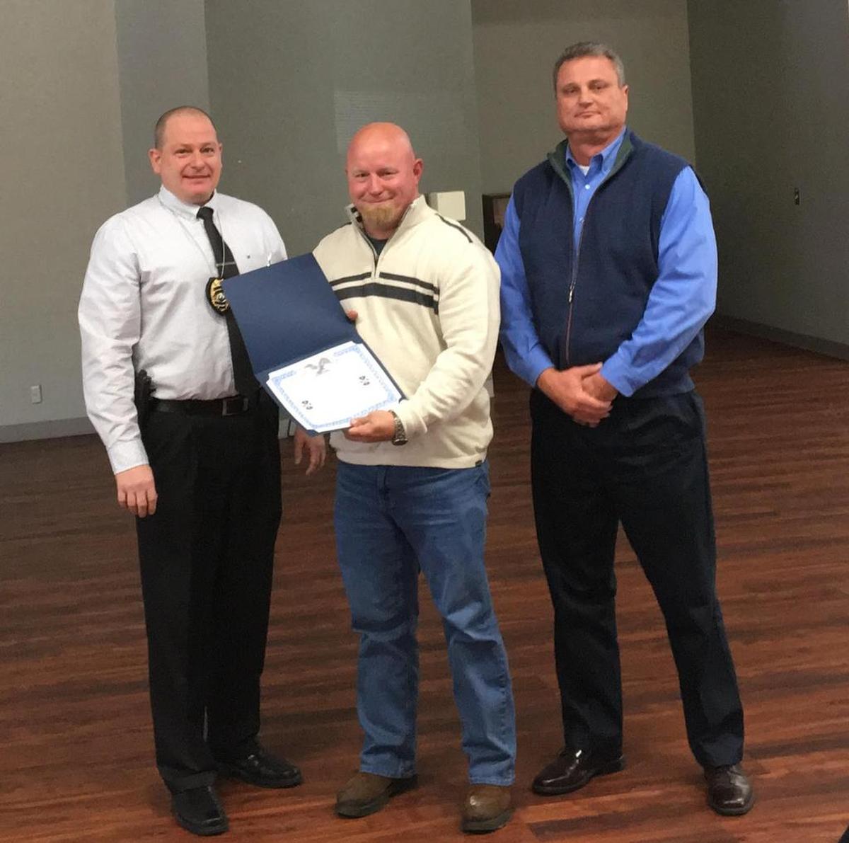 O’Fallon Public Safety Department 2017 Employee of the Year awards were given during the Thursday, Dec. 7 annual awards event. From left, Chief Eric Van Hook, Paramedic/EMT Timothy McClain and Jeff Wild, EMS business manager.