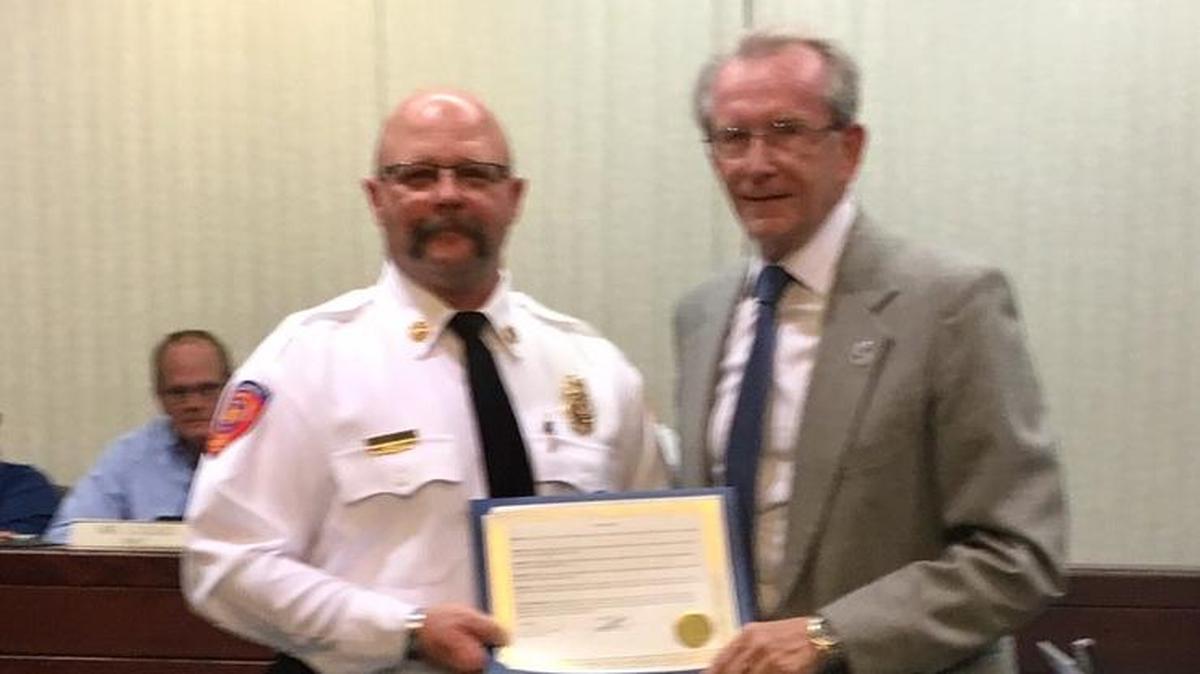 O’Fallon Mayor Herb Roach presents Fire Prevention Week proclamation to Fire Chief Brent Saunders.