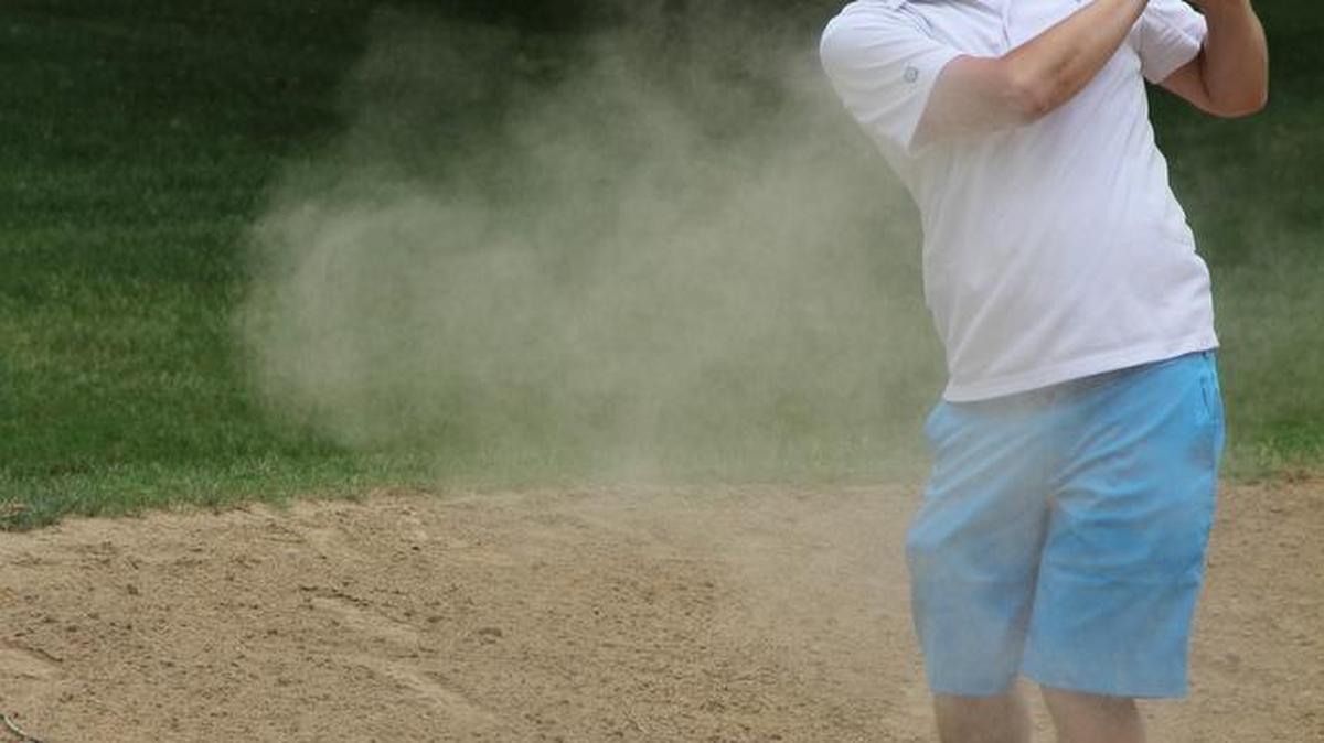 Dustin Musenbrock of Aviston chips the ball onto the green during Friday’s O’Fallon Fire Department’s 17th Annual Spring Golf Classic. The tourney, held at Tamarack Country Club in Shiloh, raises money for the volunteer fire department.