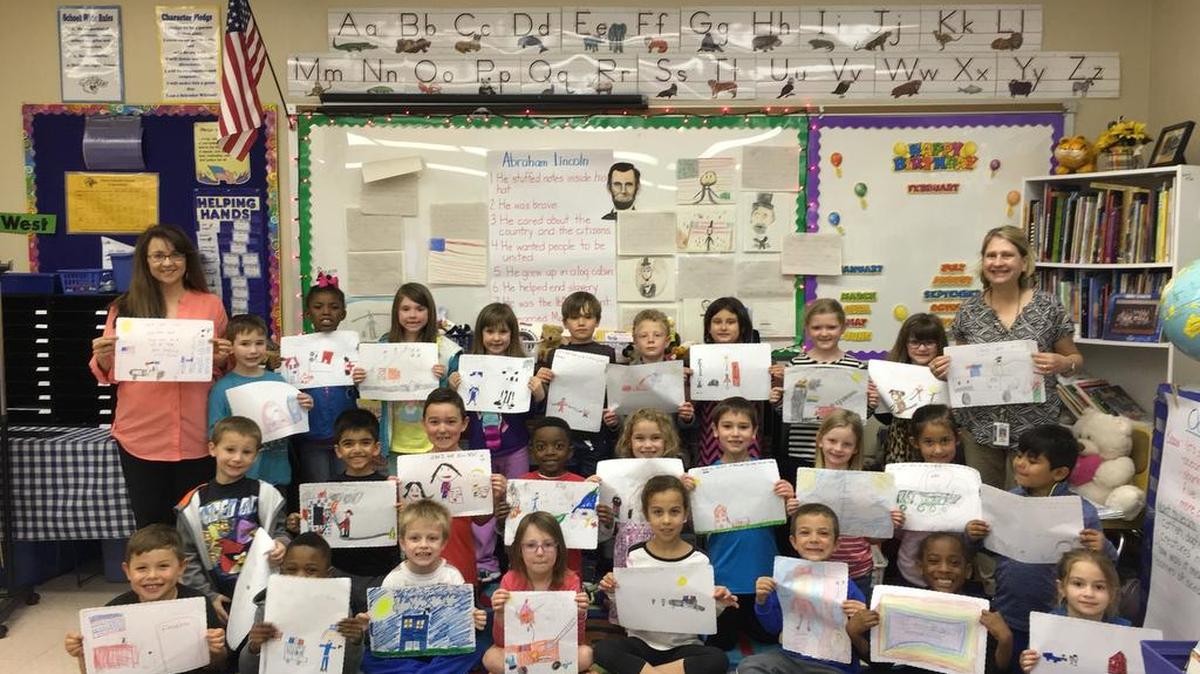 Extending appreciation ... Students in Adelita Robert's first grade class and Michelle Hamby's second grade class at Marie Schaefer Elementary school expressed their appreciation to the city's First Responders by decorating placemats with scenes depicting many of the activities performed by police, fire and emergency personnel. The placemats were put to good use at the O'Fallon Woman's Club Ninth Annual Red, White, & Blue Breakfast to honor these First Responders. The breakfast was held Thursday, March 10 at the O’Fallon Safety Center on Seven Hills Road.