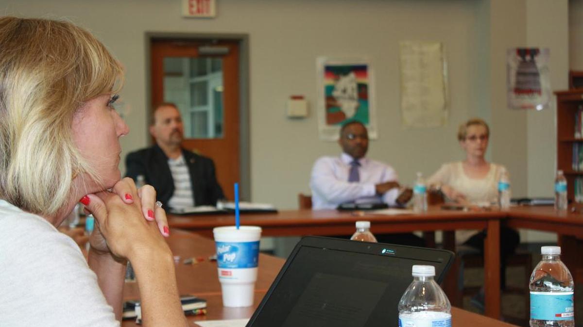 From left, O’Fallon Community Consolidated School District 90 superintendent Carrie Hruby; Paul Evans, O’Fallon-Shiloh Chamber of Commerce president; Brandt House and Laura Jacobi-Van Hook, both O’Fallon Township High School District 203 board members, all listen to other BEST committee members Wednesday, July 19 at Shiloh Middle School during talks about funding sources for a consolidation feasibility study.