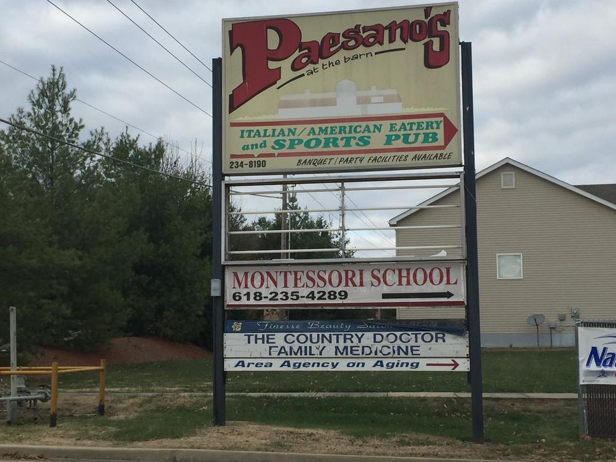 An old sign in this 2015 file photo advertises Paesano’s at the Barn, an Italian-American restaurant and sports bar that once operated in the Red Barn on Country Lane in Shiloh.