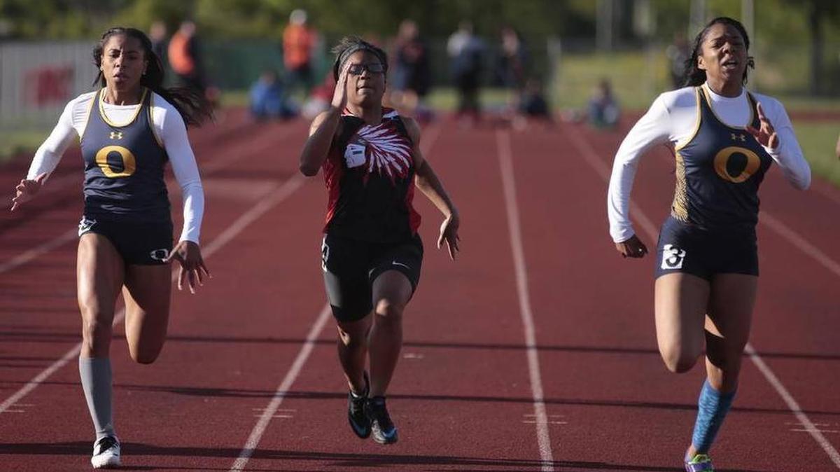 Left to right, O’Fallon Panther Kersten Douglas; Granite City Andrea Hyde; and, Tamya Houston, Progress’ Athlete of the Week of May 5, 2016, run during the Southwestern Conference in Edwardsville.