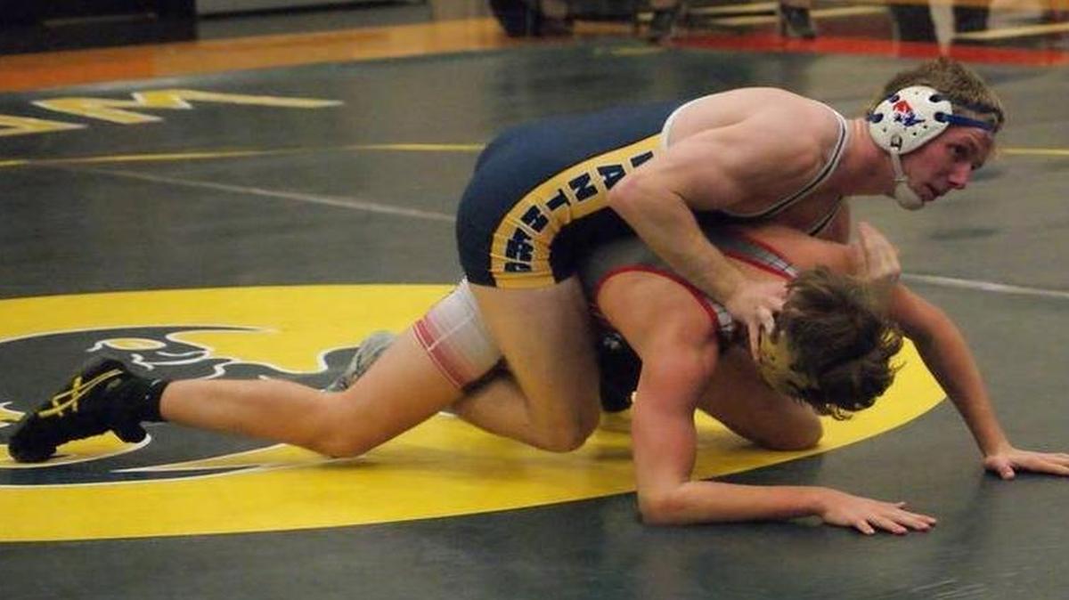 O’Fallon wrestler Jack Bond takes control of Highland’s Devin Wills en route to posting a 19-4 technical fall-victory in their 160-pound match in a triangular match at Highland High School this season. Bond was recently named an All-Southwestern Conference wrestling selection for the 2016-2017 season.