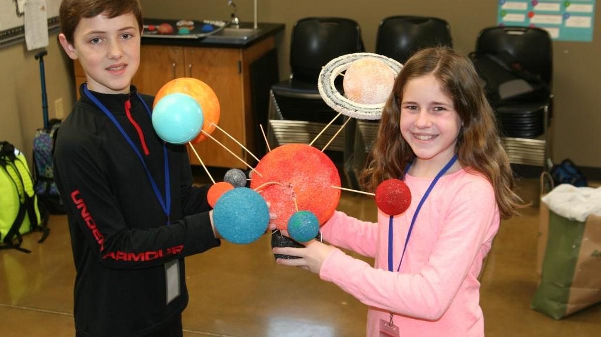 The sixth graders in Allyson Otey’s class, at First Baptist Academy have been off in space exploring the amazing solar system by making their own models. Noah Burney and Lindsey Nickles hold up their model.