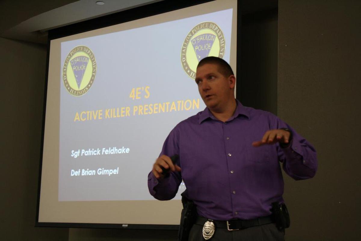 O’Fallon Police Detective Brian Gimpel tells about 100 attendees of the O’Fallon-Shiloh Chamber of Commerce luncheon at the Katy Cavins Community Center Wednesday, Jan. 10, what their options are in the event that an active killer attacks a business, school, church or public venue as a part of the OPD’s effort to educate the community active killer events.