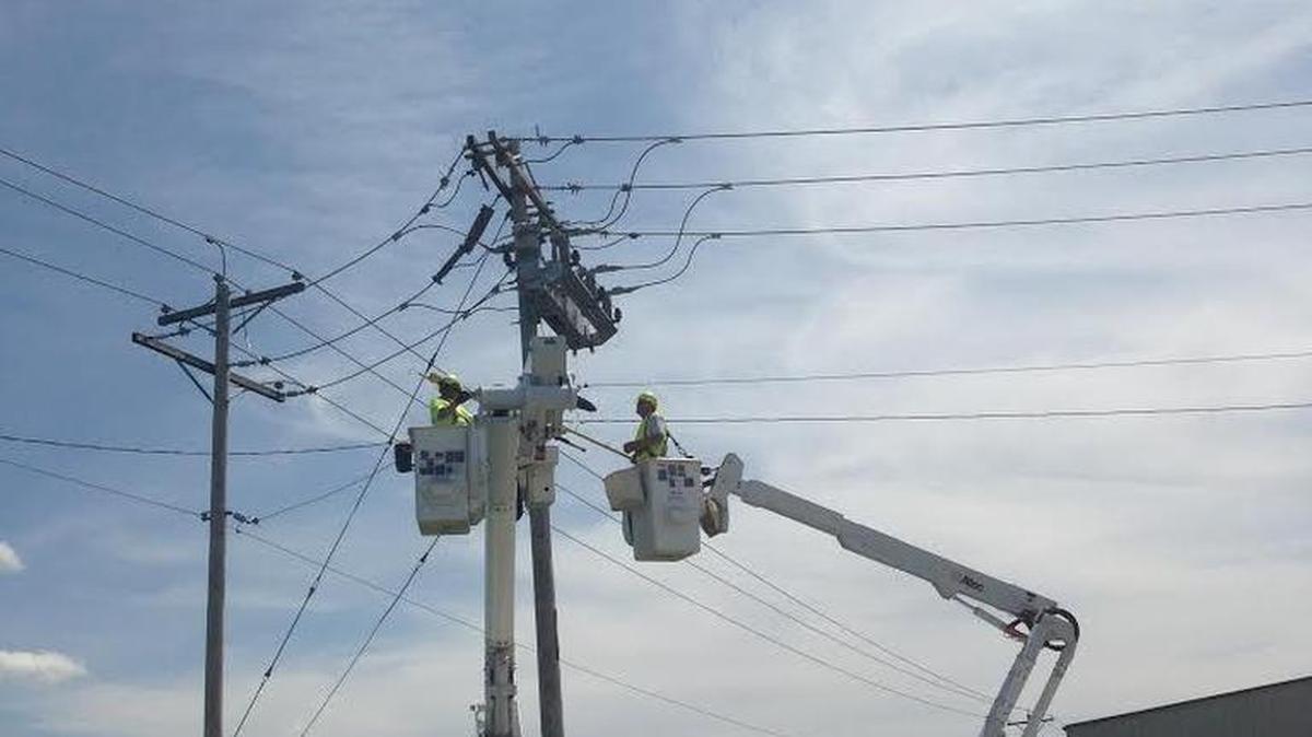 Ameren Illinois crews inspect a newly installed IntelliRupter tied into the grid supporting O’Fallon. The crews were working in the 1400 block of Frontage Road in town.