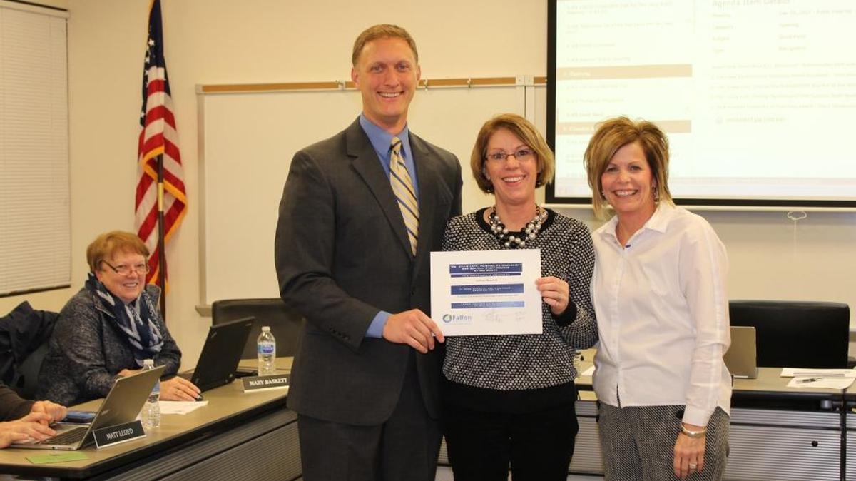 From left, John Wagnon, O’Fallon School District 90 Board of Education president; Colleen Headrick, an accounts payable support staff at the district office; and, Patty Cavins, the district’s business manager, honor the staffer of the month for December 2017 during the BOE monthly board meeting last month.